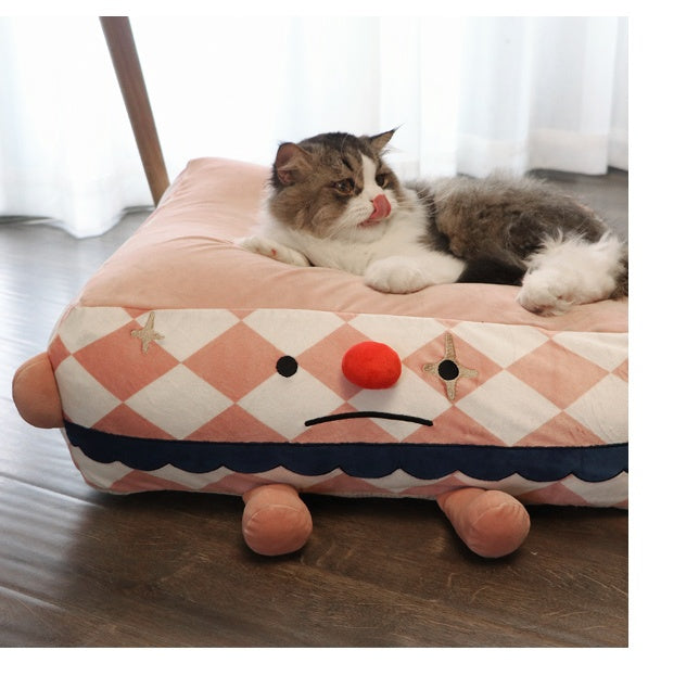 Clown Pet Sleeps In A Cozy Pet Bed